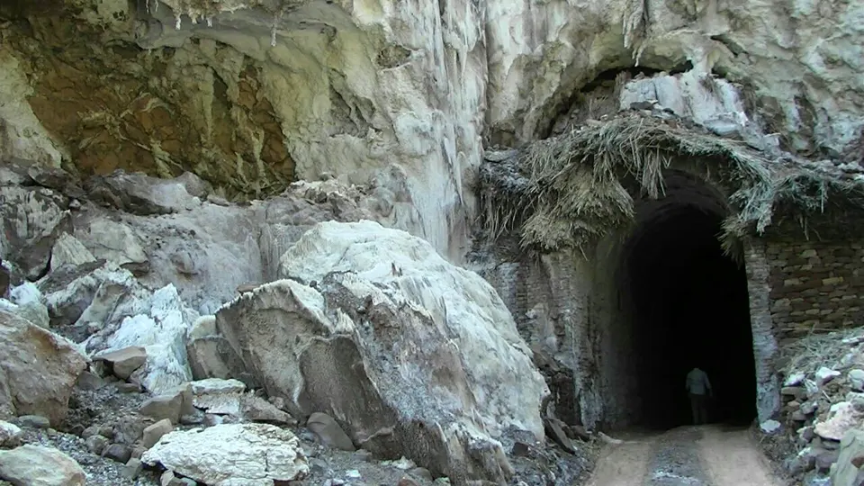 Tunnel entrance and broken white rock at a mine in Pakistan